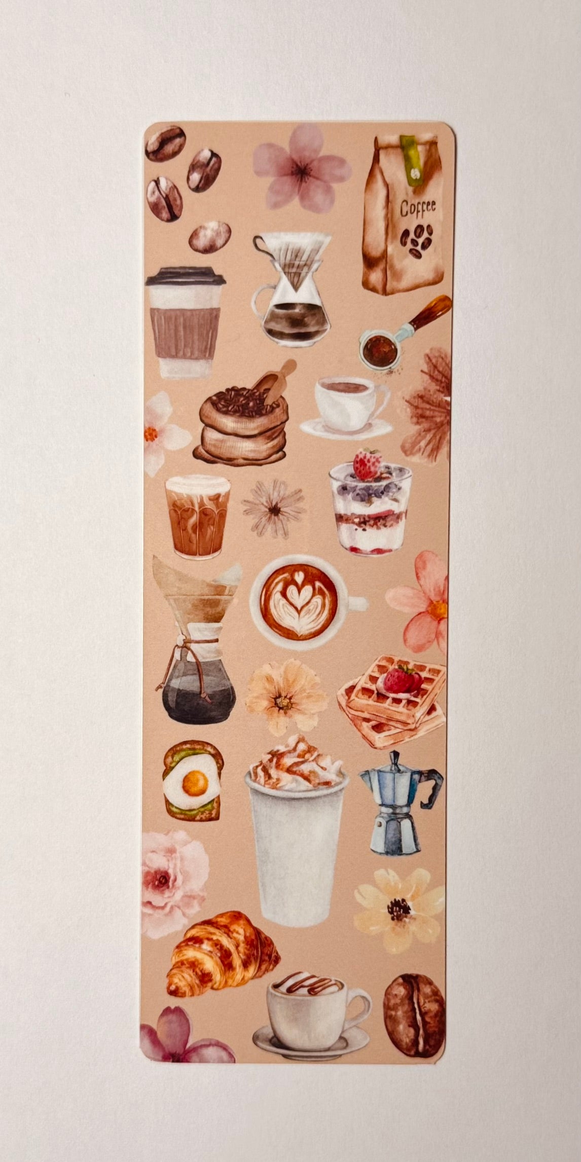 Bookmark with coffee-themed design on a beige background